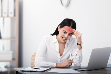 Wall Mural - Woman suffering from migraine at workplace in office