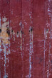 © Pavel - old scratched red painted wooden door texture background