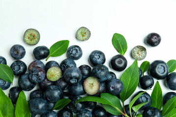 Fresh blueberry with leaves on white background