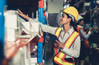 Female warehouse worker working at the storehouse . Logistics , supply chain and warehouse business concept .