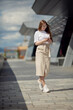 © Alena - young cute woman walking in the city