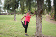 Young curvy woman doing sport outdoor - Concept of healthy lifestyle and sport