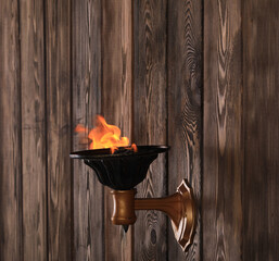 Canvas Print - ancient torch on a wooden wall