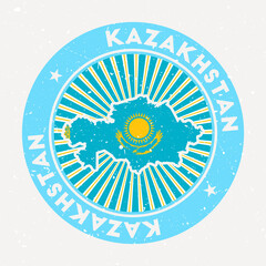 Wall Mural - Kazakhstan round stamp. Logo of country with flag. Vintage badge with circular text and stars, vector illustration.