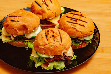 home made burgers on wooden background. cheeseburger, burger, hamburger, beef