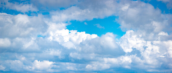 Wall Mural - white clouds in the blue sky in summer