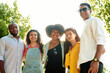© etonastenka - Multiethnic friends are walking in the park and looking at the camera, smiling