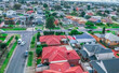 Panoramic aerial view of Melbournes western suburbs and CBD looking down at Houses roads and Parks Victoria 