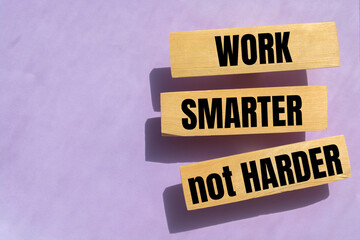 Wall Mural - Work Smarter not harder words phrase on Wooden blocks. High salary, business profit or self motivation concept.