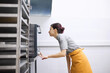 © Anischenko - The pastry chef checks the readiness of the dish in the oven
