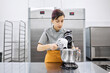 © Anischenko - Pastry chef girl prepares fresh cakes at her small production facility
