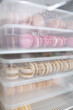 © Anischenko - Colorful macaroons in transparent boxes are stored in the refrigerator