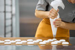 © Anischenko - Pastry chef girl prepares fresh cakes at her small production facility