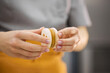 © Anischenko - A bright girl holds fresh cakes and macaroons in her hands