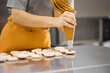 © Anischenko - Pastry chef girl prepares fresh cakes at her small production facility