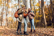 © Zoran Zeremski - Three female friends enjoying hiking in forest on a beautiful autumn day.
