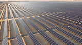 Fototapeta  - AERIAL. Top view of huge solar energy plant in the desert.