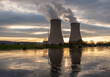 © wlad074 - Nuclear power plant against sky by the river at sunset