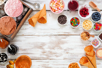 Aufkleber - Summer ice cream buffet with a variety of ice cream flavors and sweet toppings. Above view frame over a rustic white wood background.