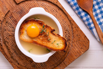 Poster - Thyme soup with poached egg. Traditional Spanish tapa recipe.