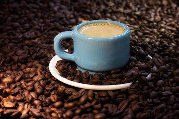 Poster - Closeup shot of a cup of coffee and roasted coffee beans