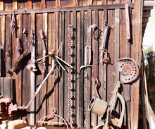 Old Rusty Farm Tools On A Wooden Background