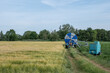 © Peeradontax - Irrigation hose reel, Agricultural Travelling Irrigator or Hose Reel Irrigation Sprinkler Machine with Water Sprinkler set up on barley wheat rice agricultural field on countryside in Germany.