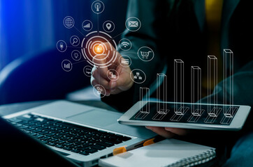 Businessman hands working on network and digital finance marketing chart with future technology innovation and digital transformation concept.
