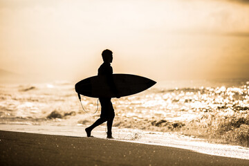 Canvas Print - Surfing themed photograph, surfers in tropical location.