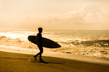 Canvas Print - Surfing themed photograph, surfers in tropical location.