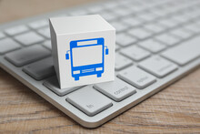Bus Flat Icon On White Block Cube With Modern Computer Keyboard On Wooden Table, Business Transportation Online Service Concept