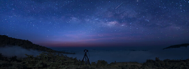 Wall Mural - panorama photo milky way galaxy at night. image contains noise and grain due to high iso. image also