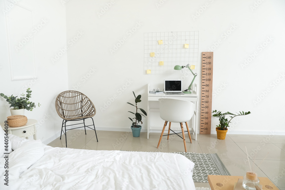 Modern workplace with stadiometer in interior of room