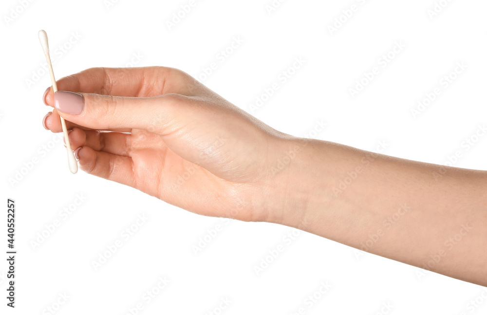 Female hand with cotton swab on white background