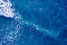 Blue Water Frothy Indonesia Ocean Surface With Big Wave. Open Sea From Aerial Top View