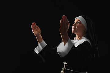 Mature nun on dark background