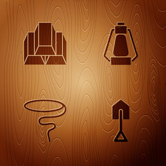 Wall Mural - Set Shovel, Gold bars, Lasso and Camping lantern on wooden background. Vector