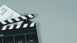 © nisara - Black and white Clapperboard or clapper board or movie slate use in video production ,film, cinema industry on gray background.