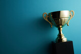 Fototapeta Konie - golden trophy on blue background