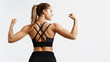 © Liubov Levytska - Sport and women. Rear view of strong fitness athlete, female bodybuilder, flexing muscles, showing fit body, biceps and athletic back, smiling satisfied, white background