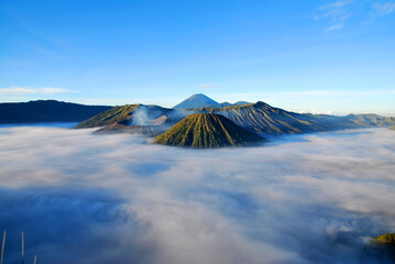 Bromo Mountain and fog around bromo mountain with sunrise from seruni viewpoint is an active volcano and part of the Tengger massif, in East Java, Indonesia. Indonesian call Gunung Bromo. Blue nature