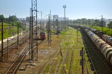 Railway tracks in the future. Train station near the city.