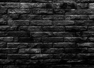  The black brick walls were neatly stacked on top of each other. On a retro black background is suitable for a texture image and the background has space for text.	