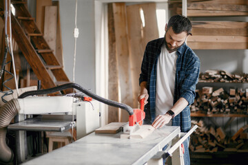 Wall Mural - Carpenter working with circular saw