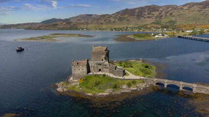 Wall Mural - The ancient Eilean Donan Castle overlooking Loch Duich in the Scottish Highlands, UK