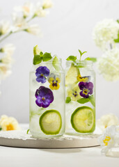 Wall Mural - Cold Infused detox water with edible flowers,lime and mint leaves. Refreshing summer drink.