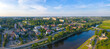 Panoramiczny widok z lotu ptaka na wschodnią część miasta Gorzów Wielkopolski wzdłuż rzeki Warta. W tle most lubuski, filharmonia gorzowska, osiedle Widok.