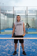 © FotoAndalucia - Young man with urban style trains paddle tennis on outdoor court