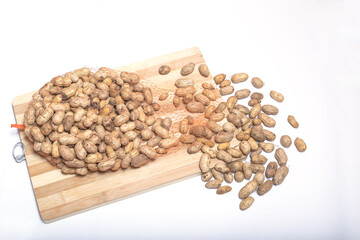 Sticker - Batch of peanuts on a cooking board