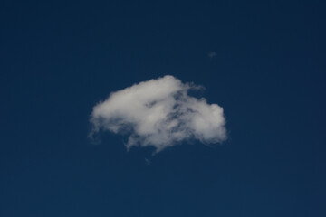 A bright, fluffy cloud against a blue sky